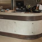 Curved Polished concrete and steel reception counter at The Lodge Space
