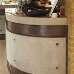 Curved polished concrete and steel reception counter at The Lodge Space