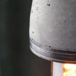 "Industrial concrete and steel exposed bulb pendant light close-up of steel rings from above" "by Brutal Design"