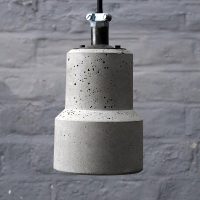 "Lander Brutalist Concrete Light with braided Flex and conduit cable clamp"